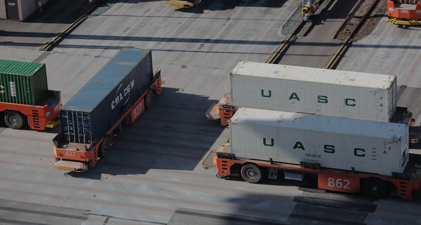 container being unloaded from a boat