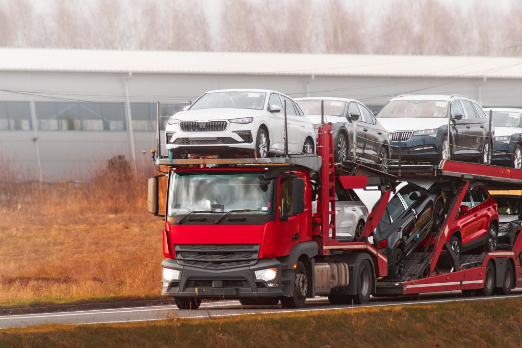 semitrailer truck loaded with new modern cars 1